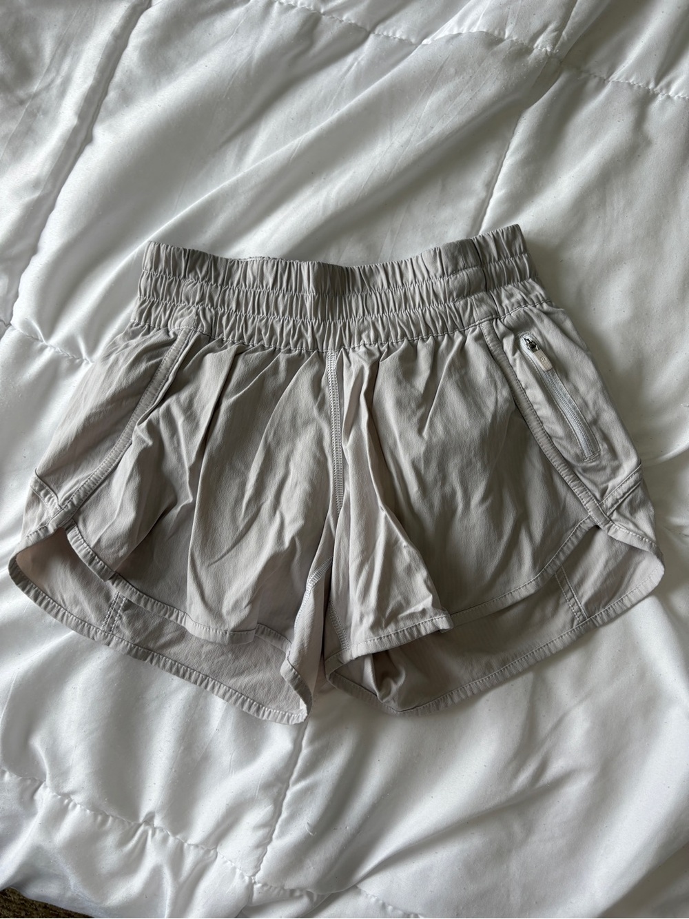 Lululemon Tracker Short 4” in a light gray/neutral color, size 4